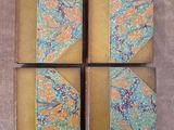 four yellow and blue book covers with floral designs on them