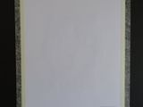 a person holding up a piece of paper with a picture on it