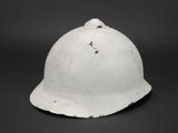a close up of a white helmet on a black background