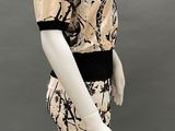 an image of a mannequin wearing a dress with a black and beige design