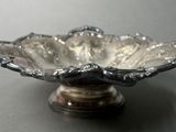 a silver bowl that is sitting on a table