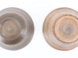 two bowls that are sitting side by side on a white surface