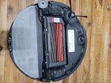 a robot that is sitting on a wooden floor