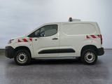 a white van with red stripes parked in a parking lot