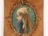 an old picture of a woman with a turban on her head