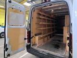 a white van with shelves in the back of it