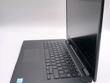 a laptop that is sitting on a white table