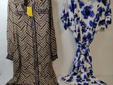 two dresses on a hanger next to a dress on a hanger