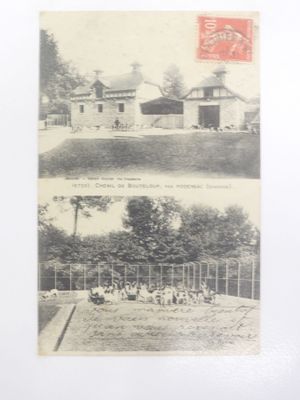 an old black and white photo of a farm and a house