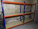 a room with a lot of shelvings in it