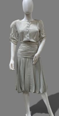 an image of a mannequin dressed in a gray dress