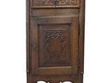 an old wooden cabinet with a door and a drawer on top of it