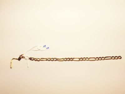 a chain that is attached to the wall with a hook