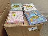 a lot of children ' s books in a box on a pallet