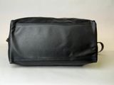 black leather toilet bag on white background with white background