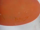 an orange balloon with a smiley face on it