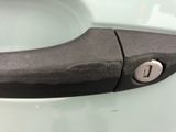 a close up of a black handle on a toilet