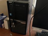 a desktop computer sitting on a desk next to a computer monitor