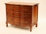 a small wooden chest of drawers on a white background