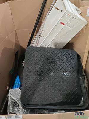 a black suitcase sitting in a box with other items