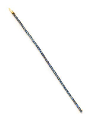 un bracelet en or et bleu orné d'une seule rangée de diamants