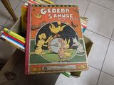 a stack of children ' s books sitting on a chair