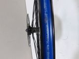 a bike wheel with a blue tube attached to it