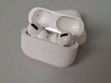 an apple airpods are sitting on top of a table