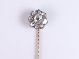 an image of a diamond stick pin on a white surface