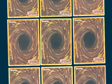 nine squares of brown and yellow squares on a blue background