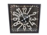 a clock that is hanging on the wall in the room