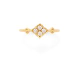 a yellow gold ring with three diamonds in the center