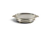 a silver plate with a handle and two legs on a white background
