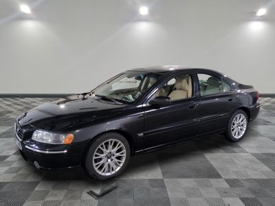 a picture of a black car parked in a garage