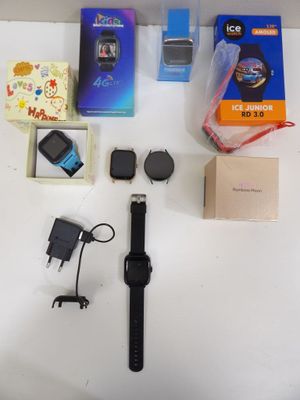 a table with a bunch of items on it including a watch and other items
