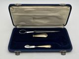 a silverware set in a blue case on a white surface