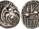 a silver coin with an image of a man on a horse
