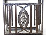 an image of a metal cage with a fish design on it