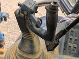 a close up of a machine with a man in the background