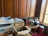 a lot of boxes and a printer on the floor