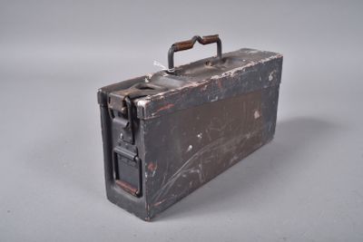 an old suitcase with a handle on a white surface