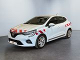 a white car with red and white stripes parked in a room