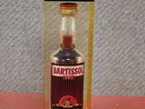 a bottle of artissol sitting on a red surface