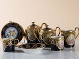 a table with a variety of tea pots and cups