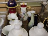 a tray with a variety of tea and coffee cups on it