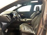 the interior of a car with the door open and the driver ' s seat up