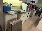 an image of a kitchen with a lot of clutter on the counter