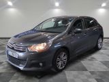 the grey citrole is parked on a checkered tile floor