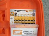 a small orange tool box filled with tools on the floor