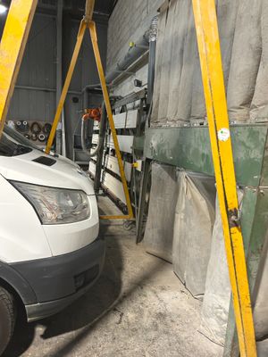 a white van that is parked in a garage